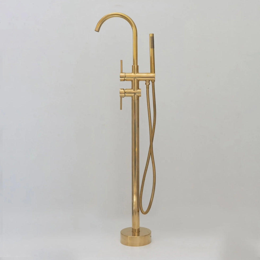 Unlacquered brass freestanding tub filler with hand shower