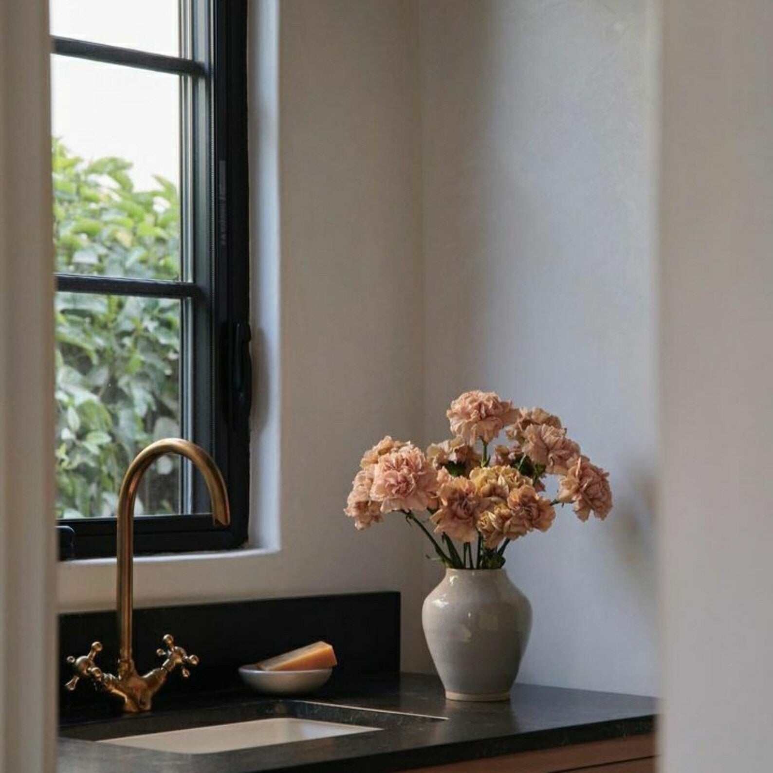 Unlacquered brass gooseneck kitchen faucet front view