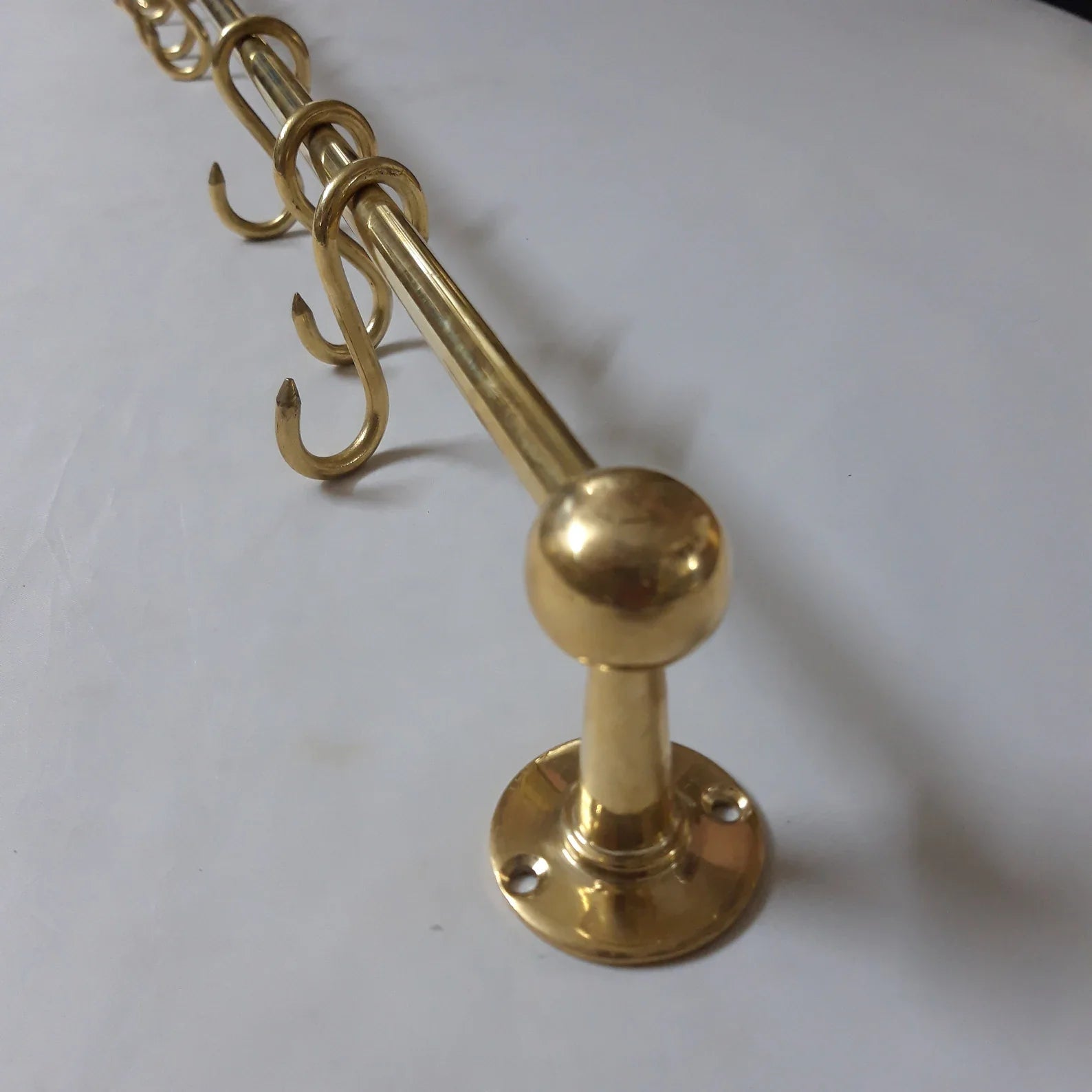 Unlacquered brass pot rack with solid brass S-hooks