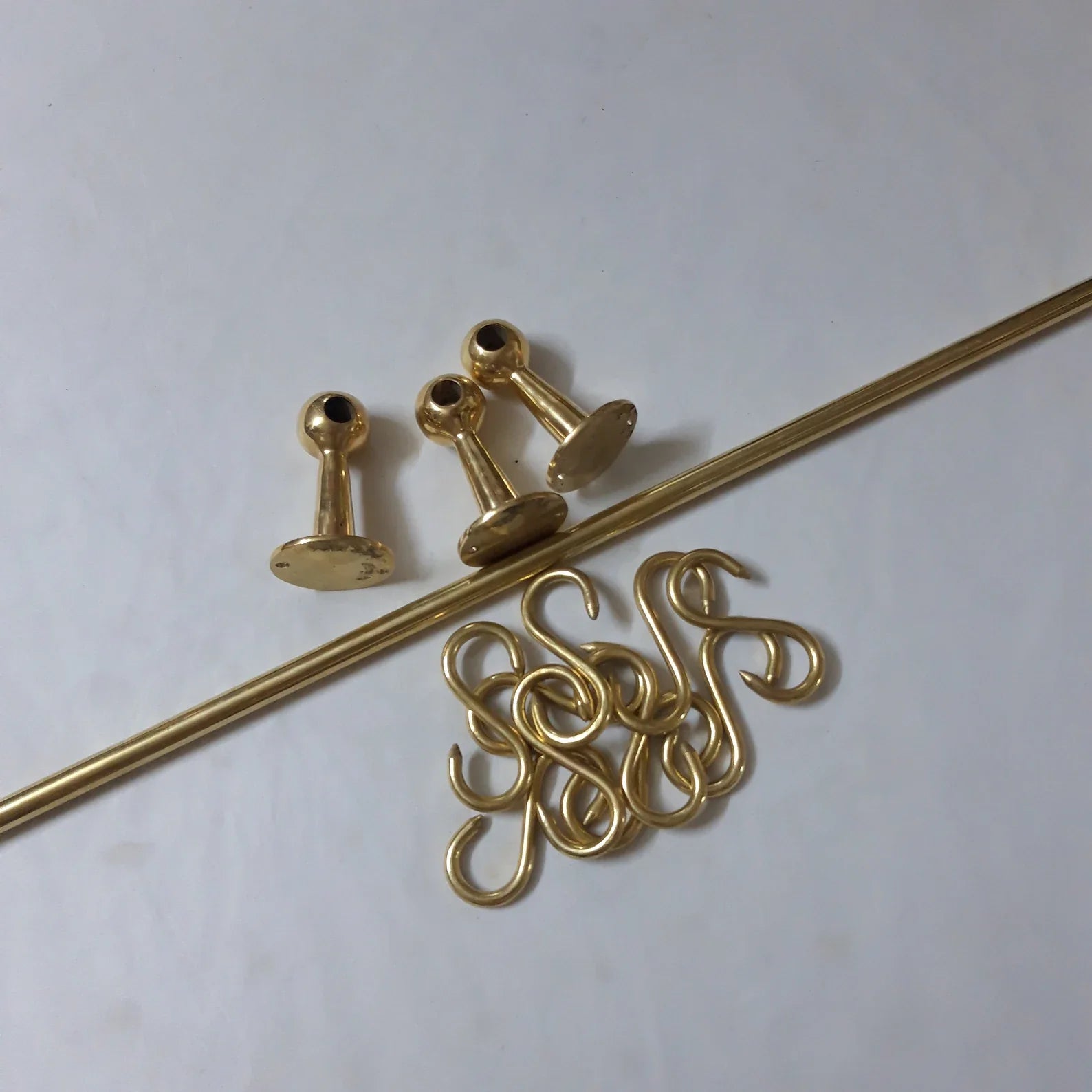 Unlacquered brass pot rack with solid brass S-hooks