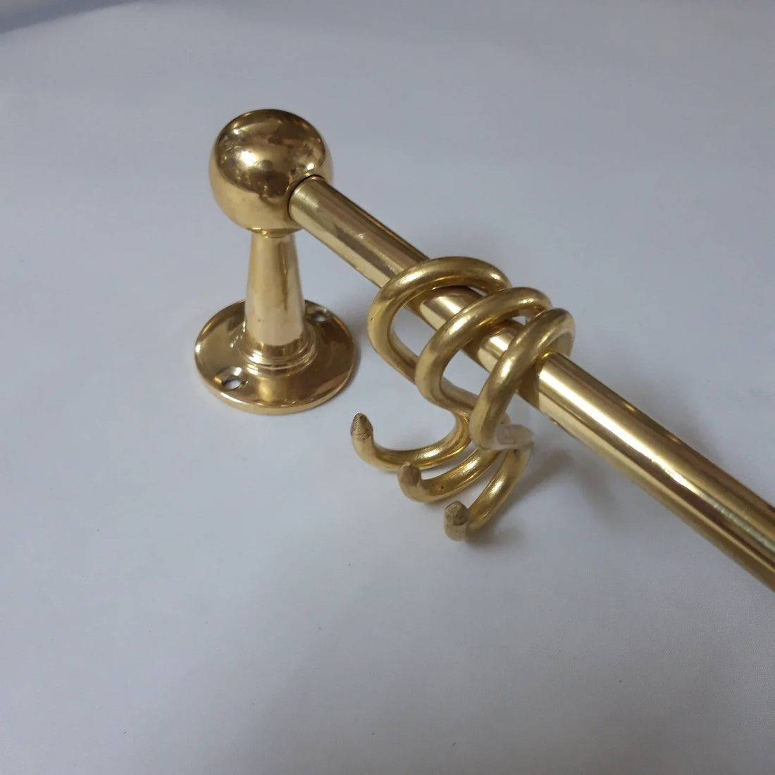Unlacquered brass pot rack with solid brass S-hooks
