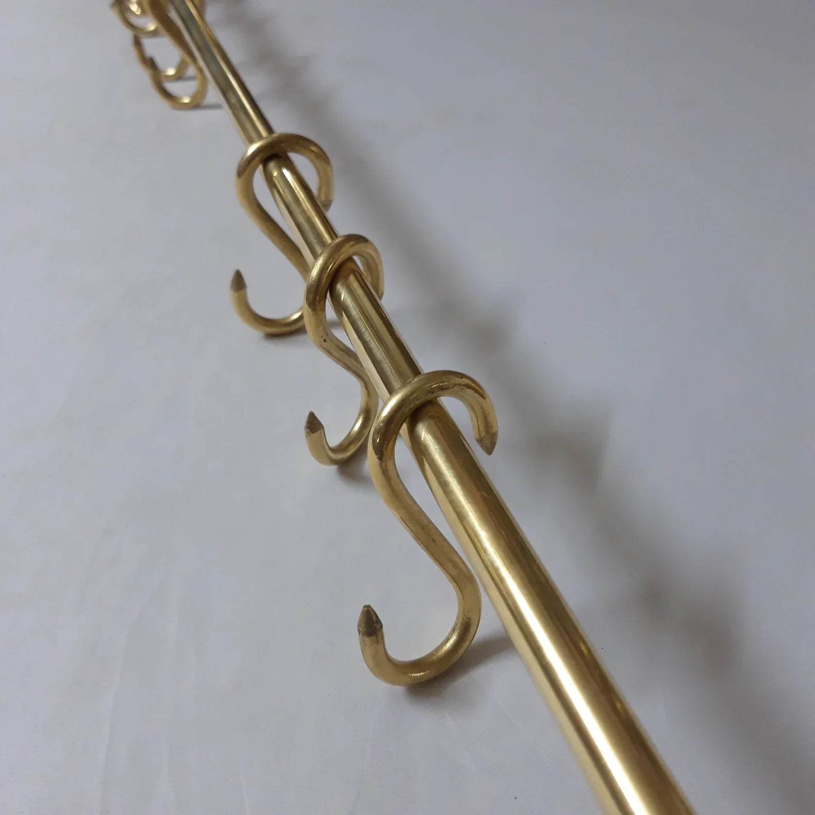 Unlacquered brass pot rack with solid brass S-hooks