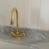 Gooseneck kitchen faucet made from solid unlacquered brass