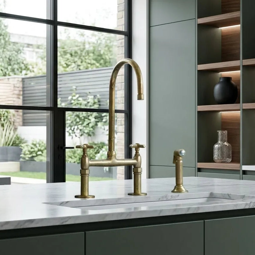 Unlacquered brass kitchen faucet with linear legs