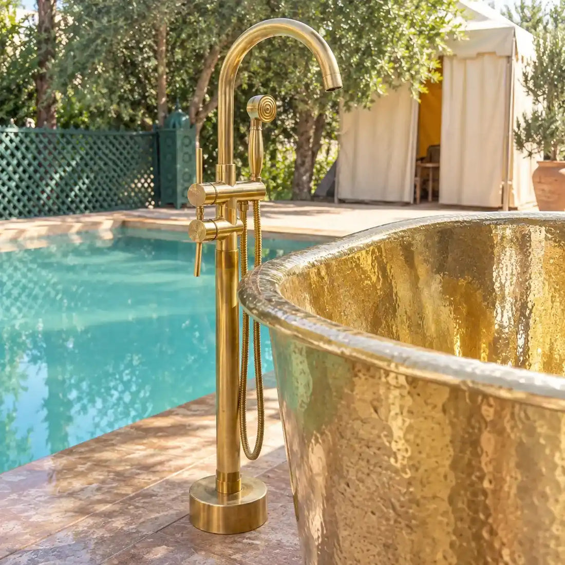 Unlacquered brass freestanding tub filler with vintage hand shower