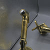 Unlacquered brass wall mount kitchen faucet with sprayer, 8 inch spread
