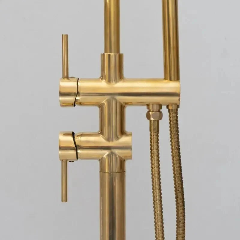 Unlacquered brass freestanding tub filler with hand shower
