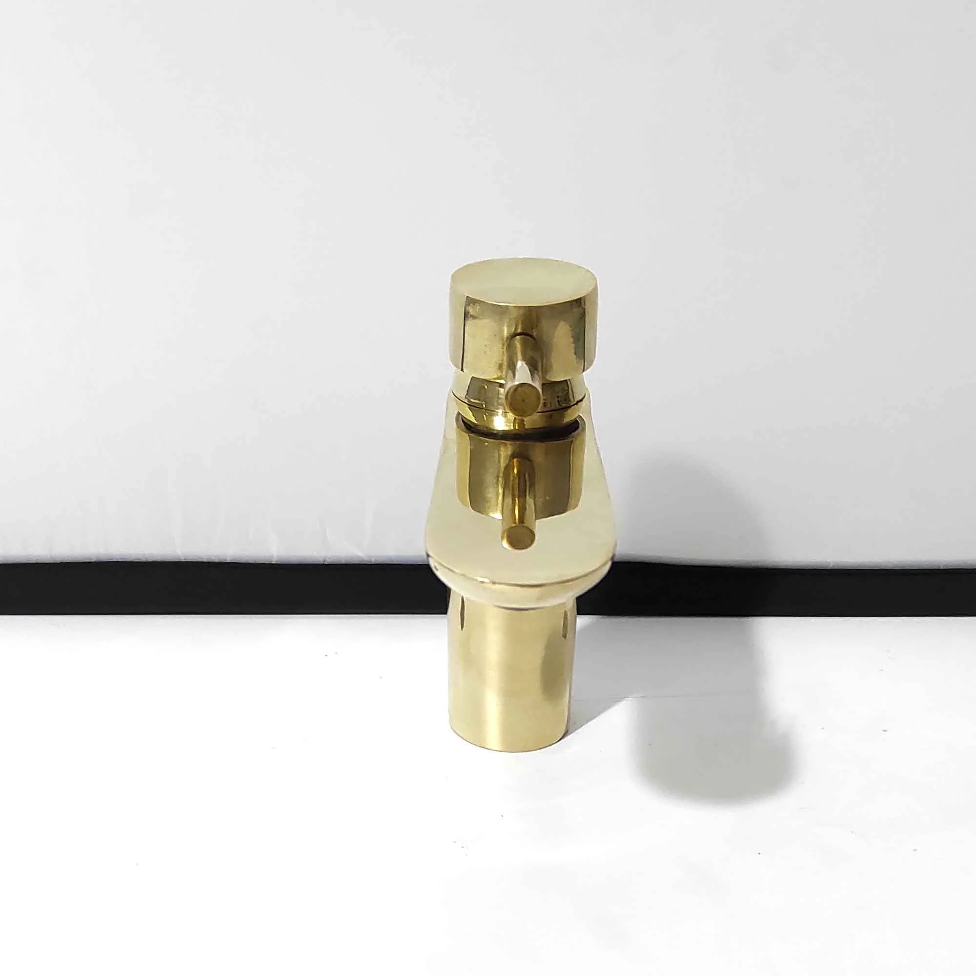 Unlaquered brass bathroom faucet 